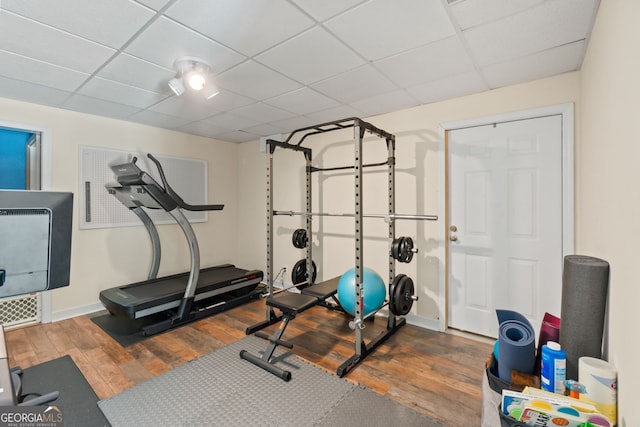 635 Piping Rock Pt, Lawrenceville, GA 30043 - workout room featuring hardwood / wood-style floors, a paneled ceiling, and baseboards