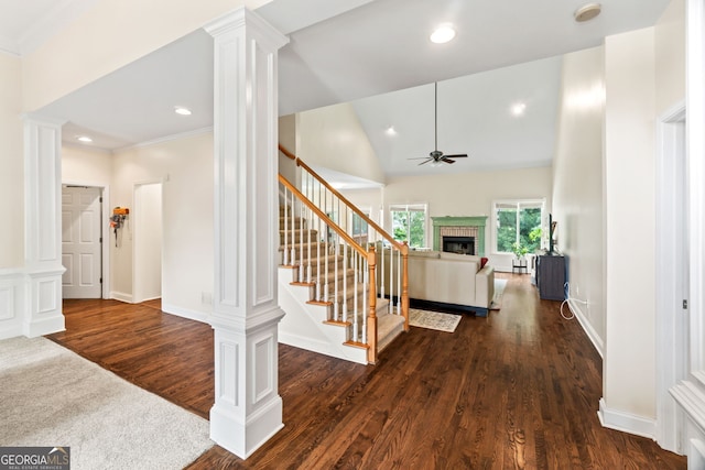 635 Piping Rock Pt, Lawrenceville, GA 30043 - entryway featuring a ceiling fan, dark wood-style floors, a brick fireplace, ornate columns, and stairway