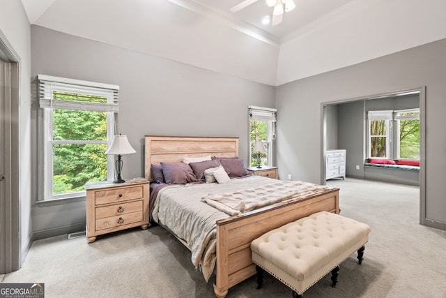 635 Piping Rock Pt, Lawrenceville, GA 30043 - bedroom featuring light colored carpet, crown molding, baseboards, a ceiling fan, and a high ceiling