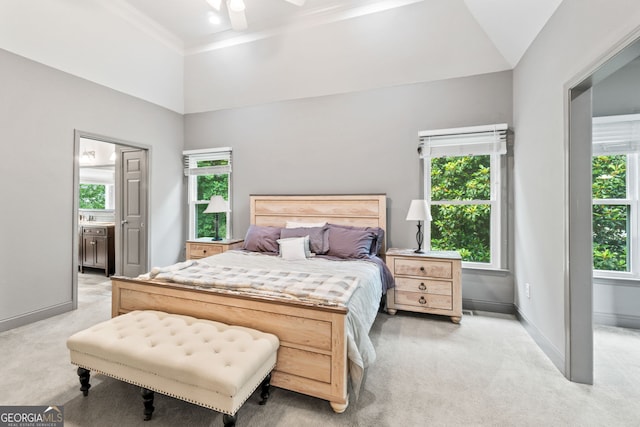 635 Piping Rock Pt, Lawrenceville, GA 30043 - bedroom with light carpet, multiple windows, baseboards, and ornamental molding
