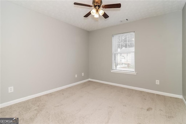 5229 Kirk Dr, Atlanta, GA 30349 - empty room with carpet floors, baseboards, ceiling fan, and a textured ceiling