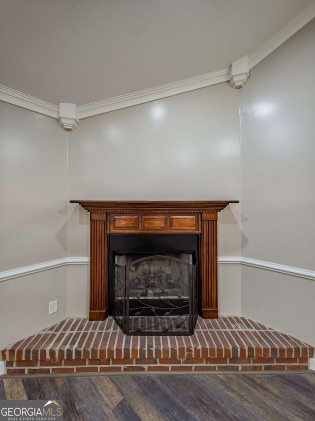 34 Alan Ln Unit 7, Tifton, GA 31793 - detailed view of wood finished floors, a fireplace with raised hearth, and crown molding