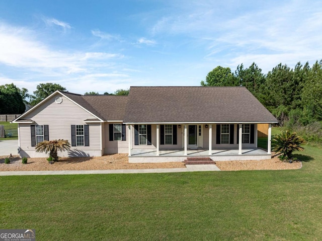 34 Alan Ln Unit 7, Tifton, GA 31793 - view of front of home with a porch, a front lawn, and roof with shingles
