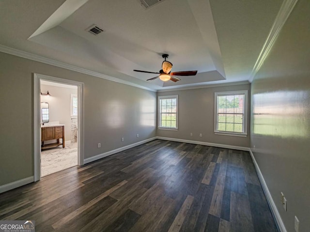 34 Alan Ln Unit 7, Tifton, GA 31793 - empty room with a raised ceiling, ornamental molding, dark wood-style flooring, and baseboards