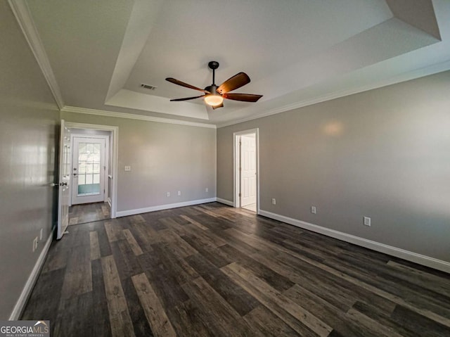 34 Alan Ln Unit 7, Tifton, GA 31793 - spare room with a raised ceiling, dark wood-style floors, baseboards, a ceiling fan, and ornamental molding