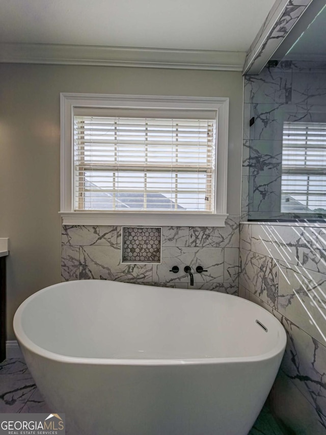 34 Alan Ln Unit 7, Tifton, GA 31793 - full bathroom featuring marble finish floors, a freestanding tub, crown molding, tile walls, and vanity