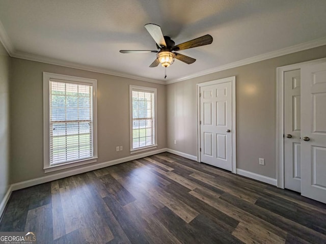 34 Alan Ln Unit 7, Tifton, GA 31793 - unfurnished bedroom with multiple windows, baseboards, dark wood-style flooring, and crown molding