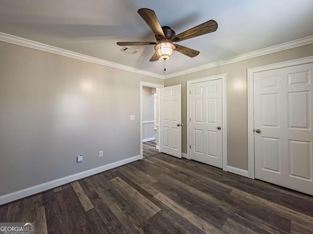 34 Alan Ln Unit 7, Tifton, GA 31793 - unfurnished bedroom with baseboards, dark wood-style flooring, crown molding, and a ceiling fan