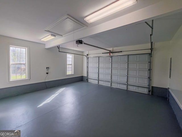 34 Alan Ln Unit 7, Tifton, GA 31793 - garage featuring a garage door opener and baseboards