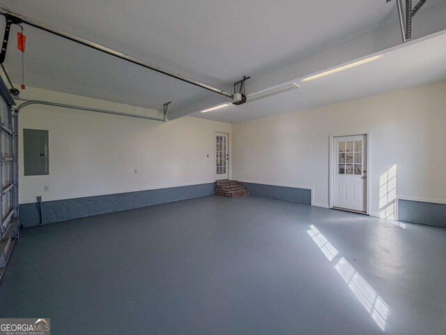 34 Alan Ln Unit 7, Tifton, GA 31793 - garage featuring electric panel and a garage door opener