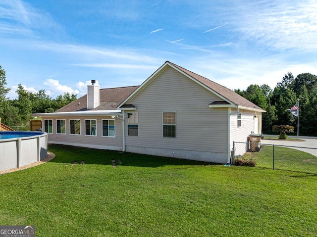 34 Alan Ln Unit 7, Tifton, GA 31793 - rear view of property with an outdoor pool and a chimney