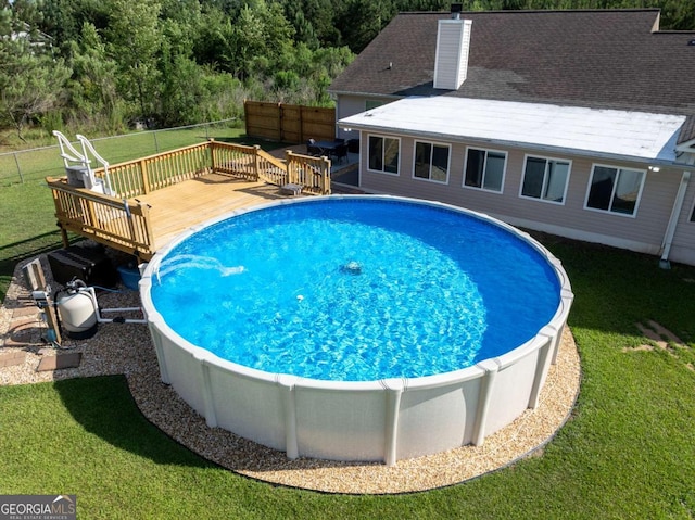 34 Alan Ln Unit 7, Tifton, GA 31793 - view of swimming pool featuring a deck and a wooded view
