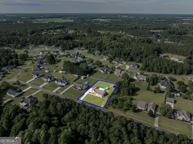 34 Alan Ln Unit 7, Tifton, GA 31793 - aerial view of property and surrounding area featuring a forest and property parcel outlined