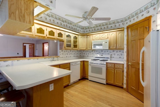 156 Spoon Hill Dr, Hayesville, NC 28904 - kitchen featuring white appliances, a peninsula, a sink, wallpapered walls, and light countertops