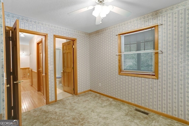 156 Spoon Hill Dr, Hayesville, NC 28904 - unfurnished bedroom featuring a ceiling fan