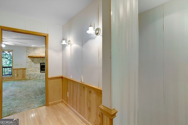 156 Spoon Hill Dr, Hayesville, NC 28904 - hallway with wood-type flooring, wainscoting, and wood walls