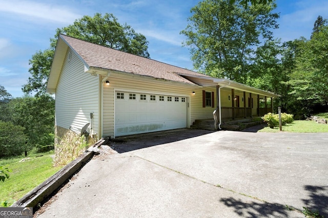 156 Spoon Hill Dr, Hayesville, NC 28904 - ranch-style home with a porch, driveway, an attached garage, and roof with shingles