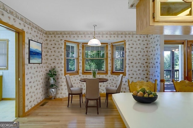 156 Spoon Hill Dr, Hayesville, NC 28904 - dining room with wallpapered walls, light wood-style floors, and baseboards