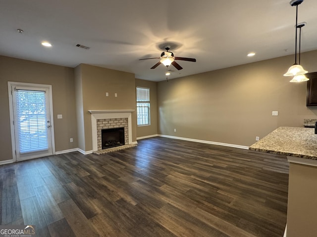 1853 Broad River Rd, Atlanta, GA 30349 - unfurnished living room with a ceiling fan, dark wood-style flooring, baseboards, and recessed lighting
