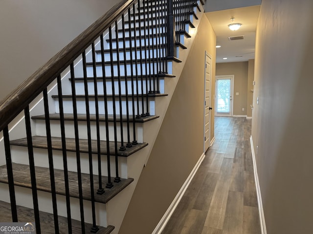 1853 Broad River Rd, Atlanta, GA 30349 - staircase featuring wood finished floors and baseboards