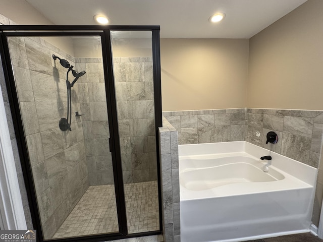 1853 Broad River Rd, Atlanta, GA 30349 - bathroom with a garden tub, a stall shower, and recessed lighting