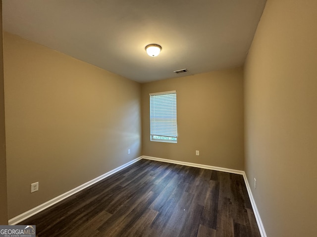 1853 Broad River Rd, Atlanta, GA 30349 - empty room with dark wood-style flooring and baseboards