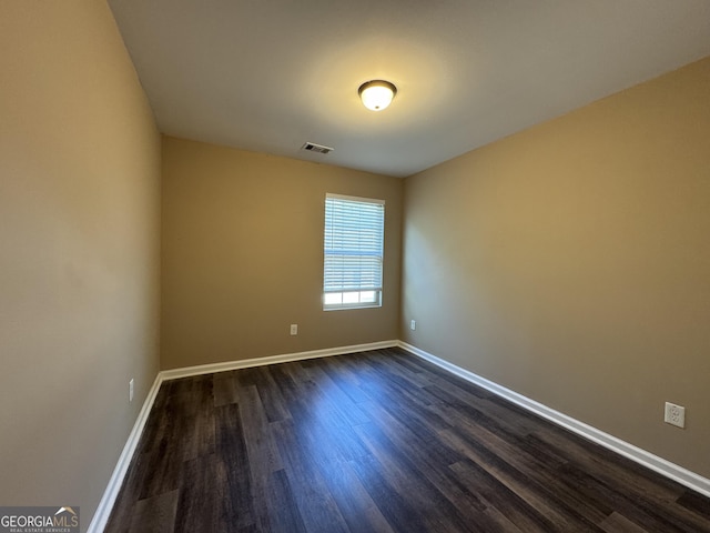 1853 Broad River Rd, Atlanta, GA 30349 - spare room featuring dark wood-style flooring and baseboards
