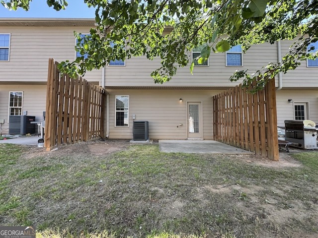 1853 Broad River Rd, Atlanta, GA 30349 - rear view of house featuring a patio and central AC unit