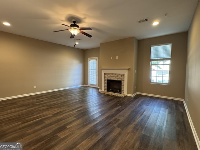 1853 Broad River Rd, Atlanta, GA 30349 - unfurnished living room with a ceiling fan, dark wood-style flooring, baseboards, a fireplace, and recessed lighting