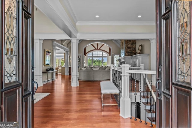 1461 N Shore Dr, Greensboro, GA 30642 - entrance foyer featuring decorative columns, wood finished floors, crown molding, and recessed lighting