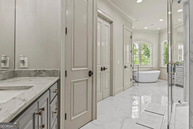 1461 N Shore Dr, Greensboro, GA 30642 - full bathroom featuring marble tiled flooring, crown molding, vanity, a soaking tub, and recessed lighting