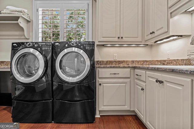 1461 N Shore Dr, Greensboro, GA 30642 - laundry room with washing machine and dryer, cabinet space, and dark wood finished floors