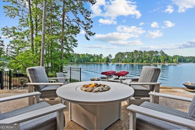 1461 N Shore Dr, Greensboro, GA 30642 - view of patio featuring an outdoor fire pit and a water view