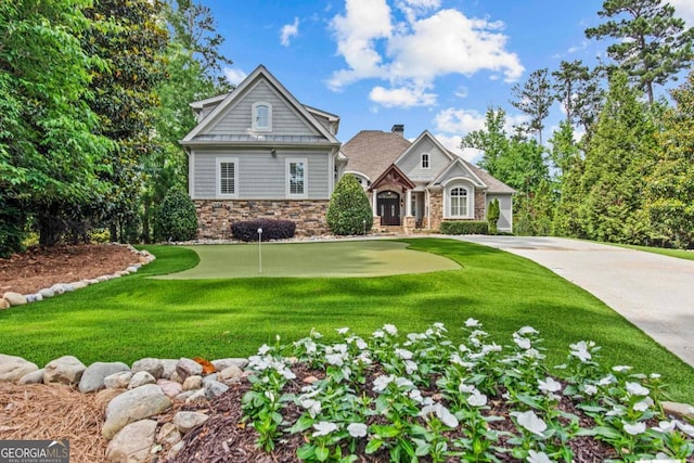 1461 N Shore Dr, Greensboro, GA 30642 - craftsman-style home with an area to practice putting, stone siding, and a front yard