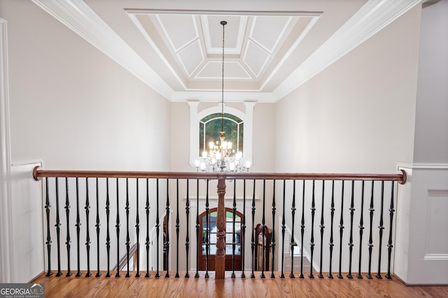 13037 Overlook Pass, Roswell, GA 30075 - hallway with a chandelier, wood finished floors, a raised ceiling, and ornamental molding