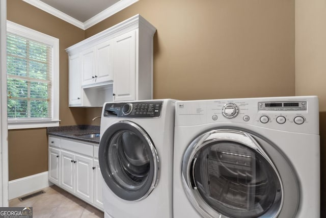 13037 Overlook Pass, Roswell, GA 30075 - laundry room featuring cabinet space, washing machine and clothes dryer, crown molding, light tile patterned flooring, and baseboards