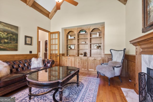 13037 Overlook Pass, Roswell, GA 30075 - living area with high vaulted ceiling, wainscoting, wood finished floors, ceiling fan, and beamed ceiling