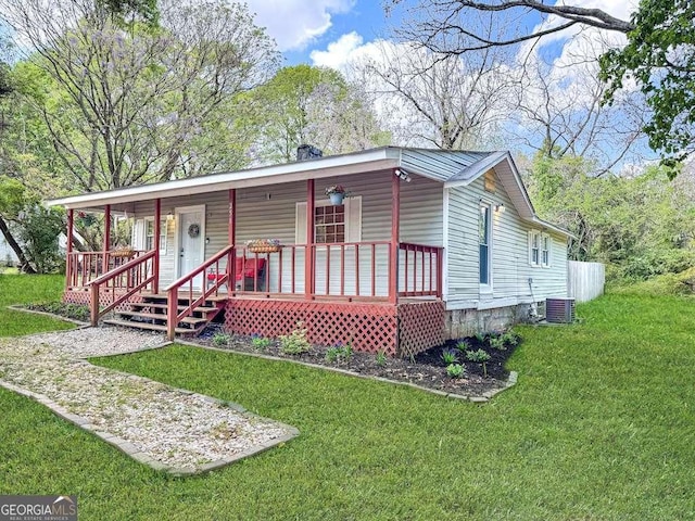 251 Lang St, Griffin, GA 30223 - view of front facade with a porch, central air condition unit, and a front yard