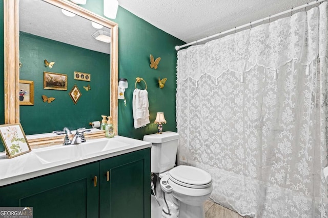 251 Lang St, Griffin, GA 30223 - bathroom with a textured ceiling, vanity, toilet, and a shower with curtain