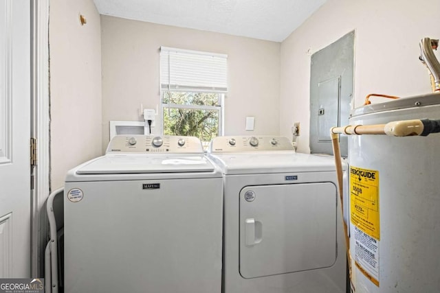 251 Lang St, Griffin, GA 30223 - washroom with gas water heater, electric panel, and separate washer and dryer