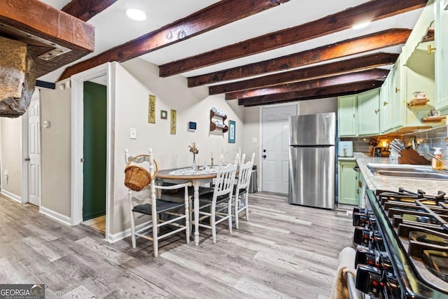 251 Lang St, Griffin, GA 30223 - dining space with beamed ceiling, light wood finished floors, baseboards, and recessed lighting