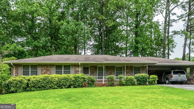 3549 Dogwood Dr, Powder Springs, GA 30127 - single story home with a front lawn, asphalt driveway, and an attached carport