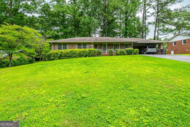 3549 Dogwood Dr, Powder Springs, GA 30127 - ranch-style home with an attached carport, driveway, a front lawn, and brick siding