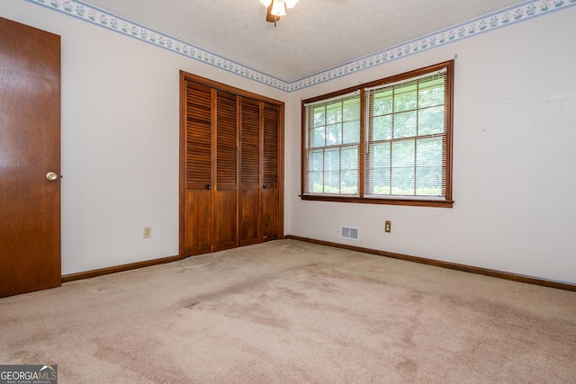 3549 Dogwood Dr, Powder Springs, GA 30127 - unfurnished bedroom featuring carpet floors, a closet, baseboards, and ceiling fan