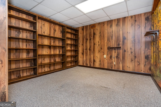 3549 Dogwood Dr, Powder Springs, GA 30127 - carpeted empty room featuring wooden walls and a paneled ceiling