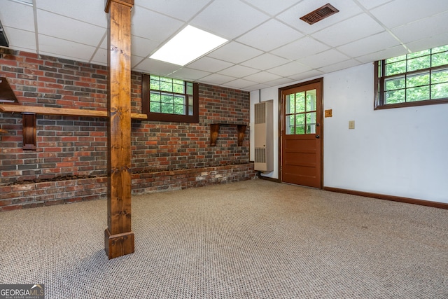 3549 Dogwood Dr, Powder Springs, GA 30127 - below grade area with healthy amount of natural light, carpet flooring, a paneled ceiling, baseboards, and a heating unit