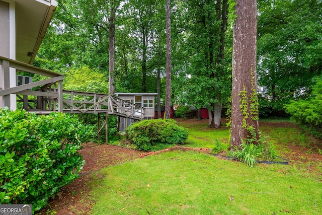 3549 Dogwood Dr, Powder Springs, GA 30127 - view of grassy yard featuring a wooden deck and stairs