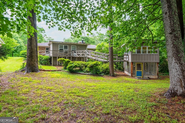 3549 Dogwood Dr, Powder Springs, GA 30127 - view of green lawn featuring a wooden deck