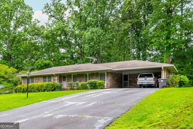 3549 Dogwood Dr, Powder Springs, GA 30127 - ranch-style house featuring asphalt driveway, a front lawn, an attached carport, and stone siding