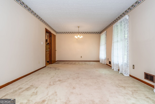 3549 Dogwood Dr, Powder Springs, GA 30127 - carpeted empty room with a chandelier and baseboards